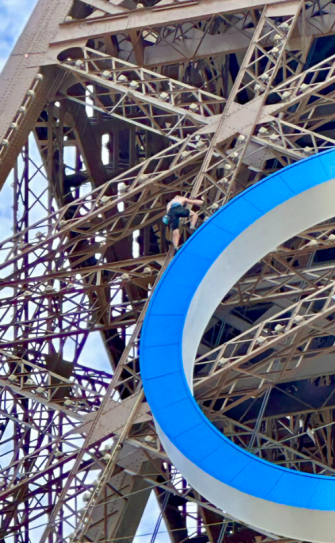 The man was seen climbing on the Olympic rings