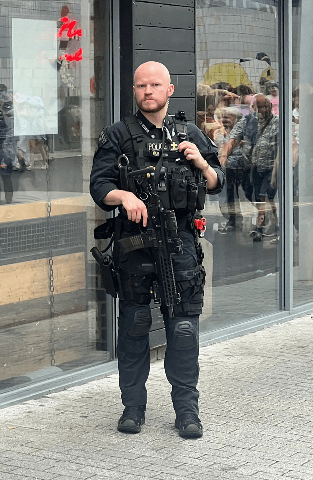 Heavily armed cops were also keeping a high profile in the surrounding area after previous threats against the US megastar