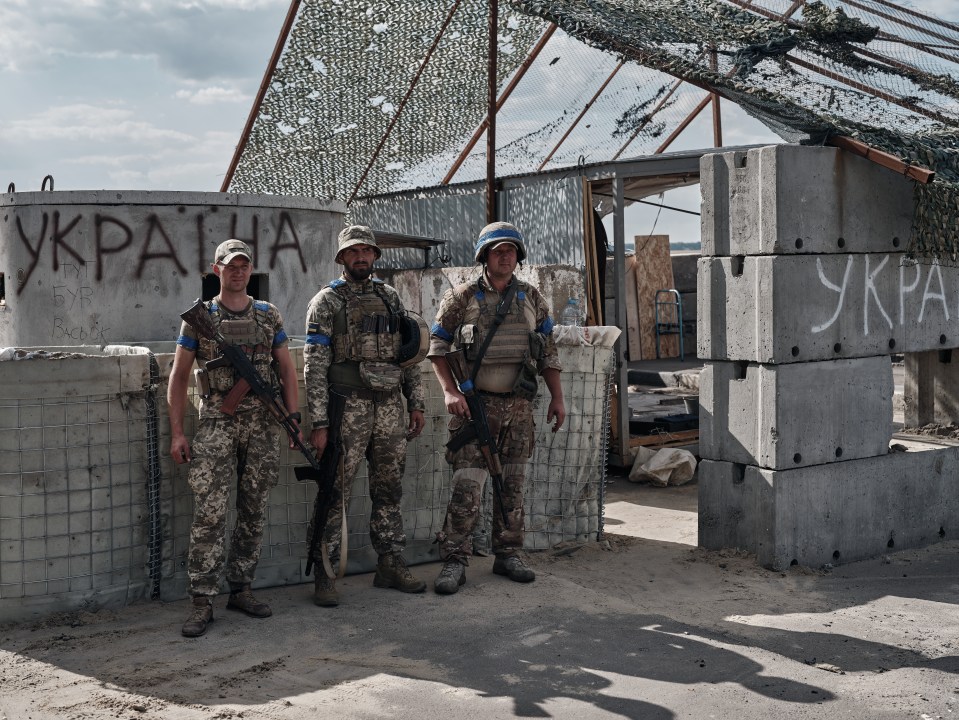 Ukrainian troops pose for a photo in Sudzha, Russia, after capturing the strategic city