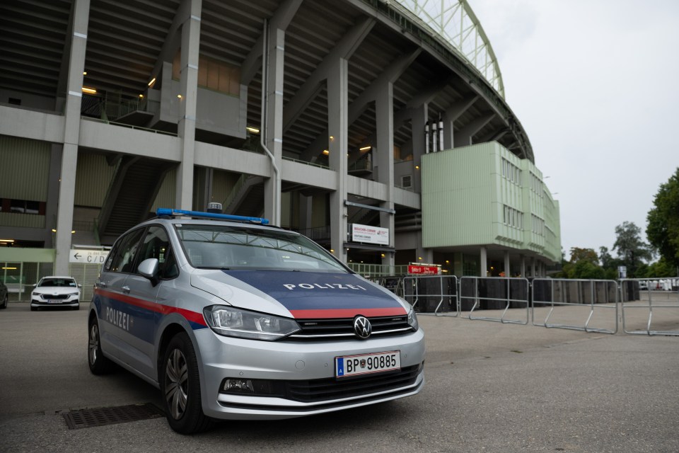 Police cars outside the stadium after the plot was foiled