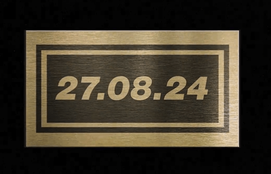 a gold sign with the date 27.08.24 on it