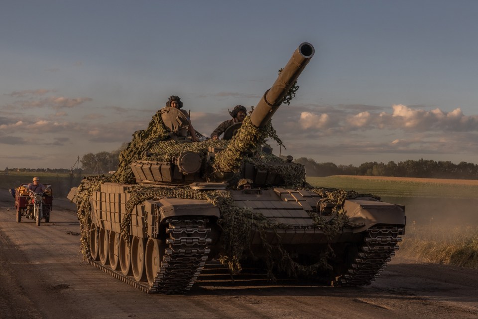 A Ukrainian tank rumbles through the Sumy region, near the border with Russia