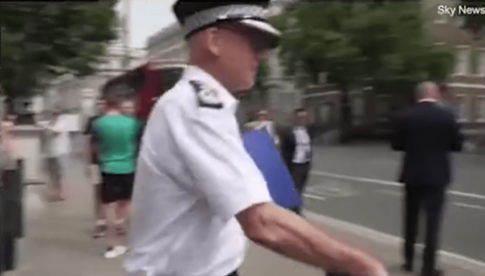 Footage shows Metropolitan Police Commissioner Sir Mark Rowley seemingly putting his hand over the reporter's mic