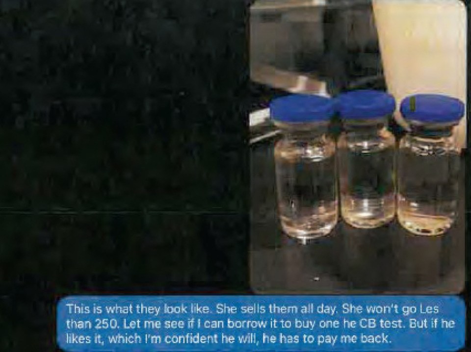 a screenshot of a text message with three bottles of liquid on a table .