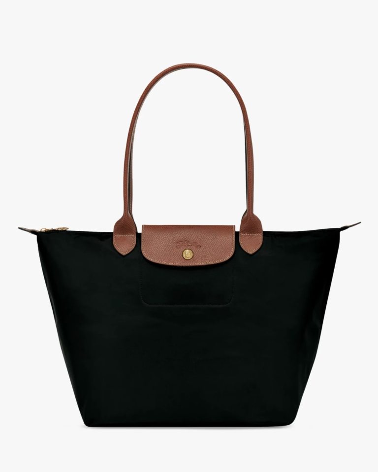 a black longchamp bag with a brown handle