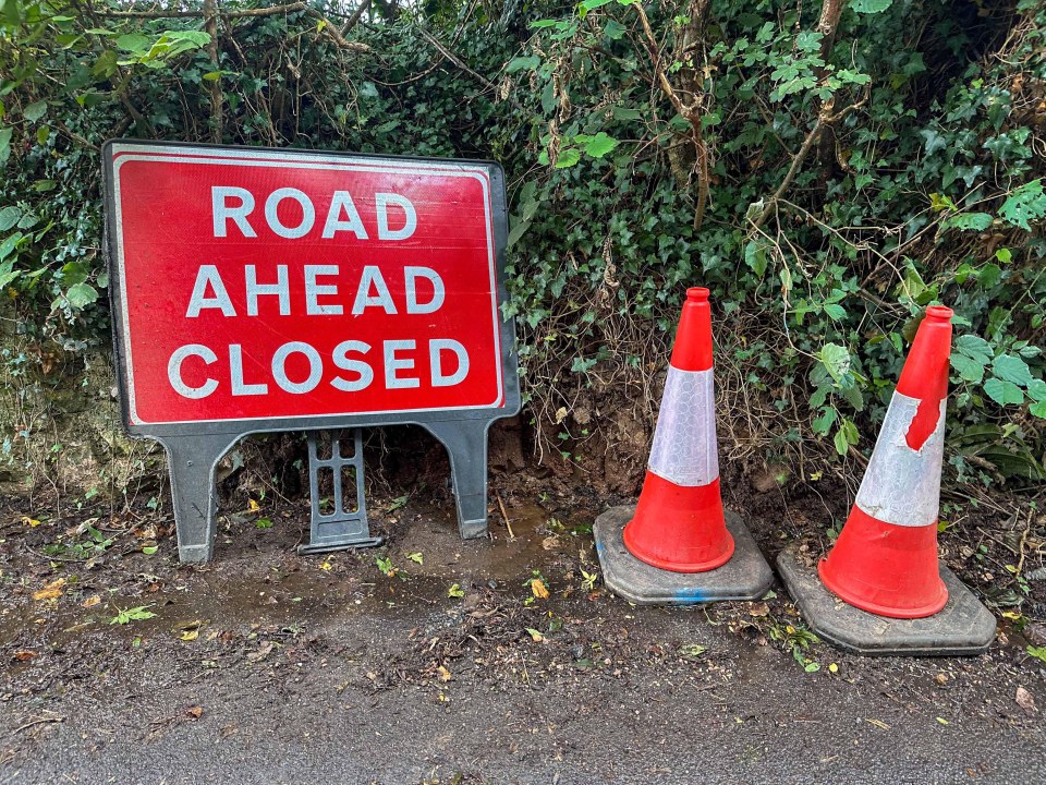 Workers left signage and cones after repairing a burst main