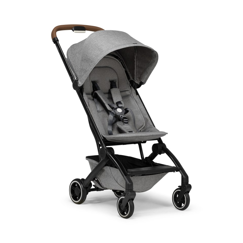 a grey stroller with a brown handle on a white background