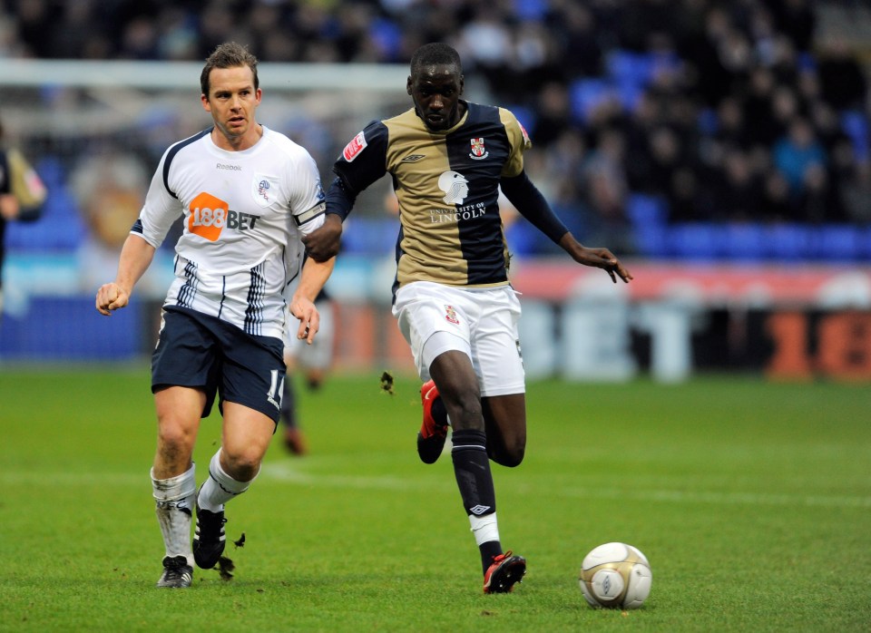 two soccer players on a field with one wearing a jersey that says 188 bet