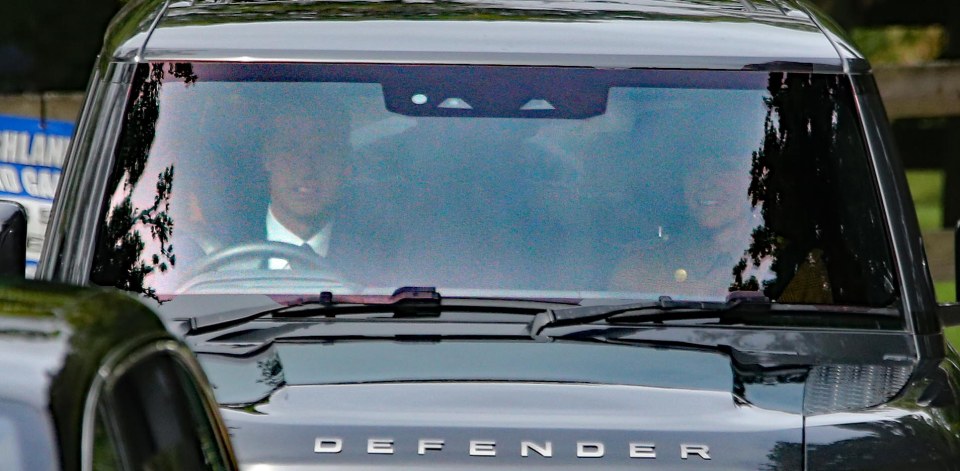 the word defender is on the front of a car