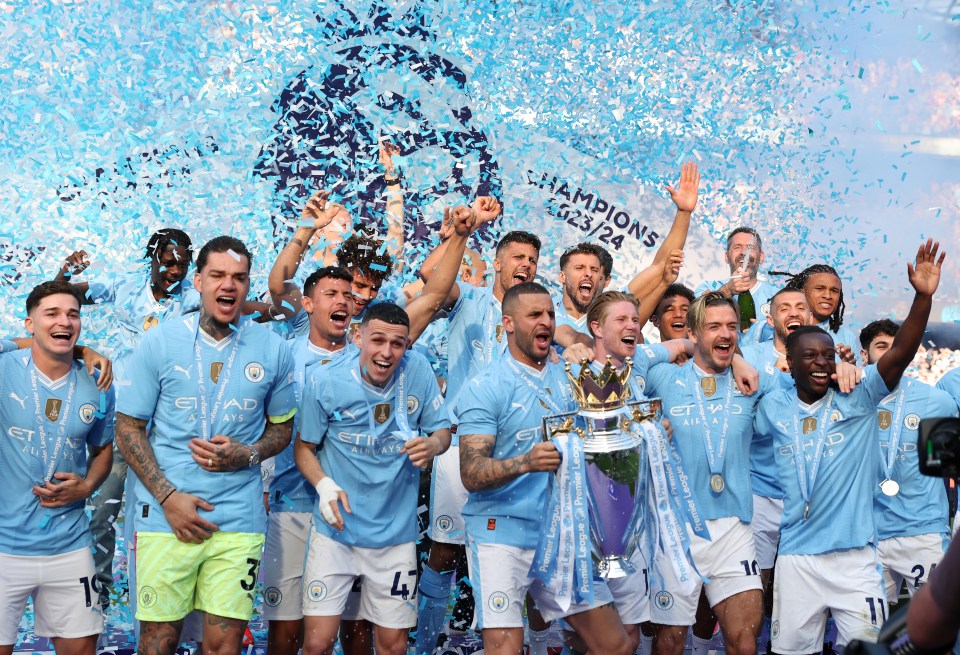 a group of soccer players celebrate winning the champions league