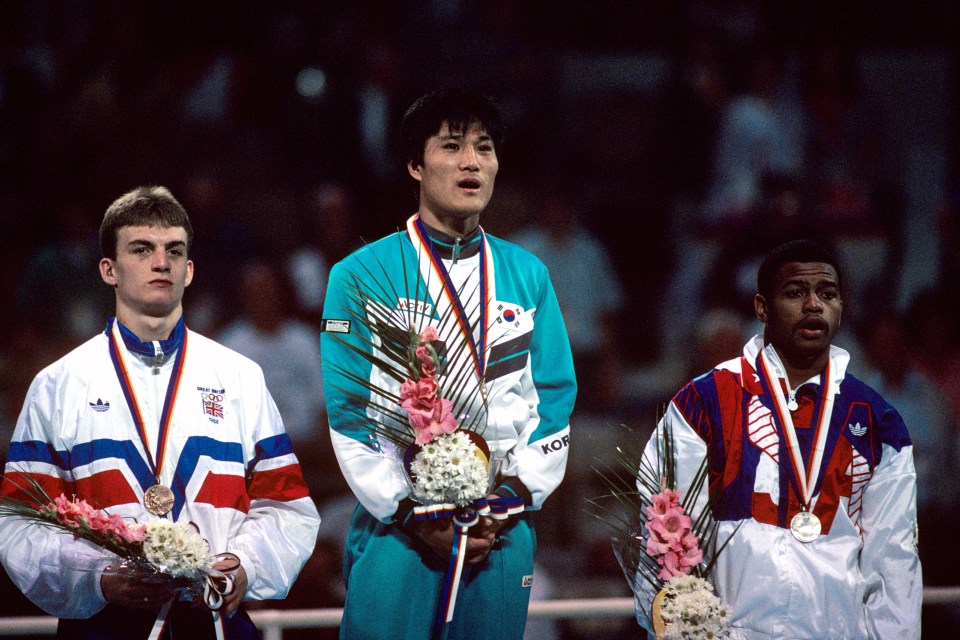 Great Britain’s Richie Woodhall, South Korea’s Park Si-Hun and Roy Jones Jr