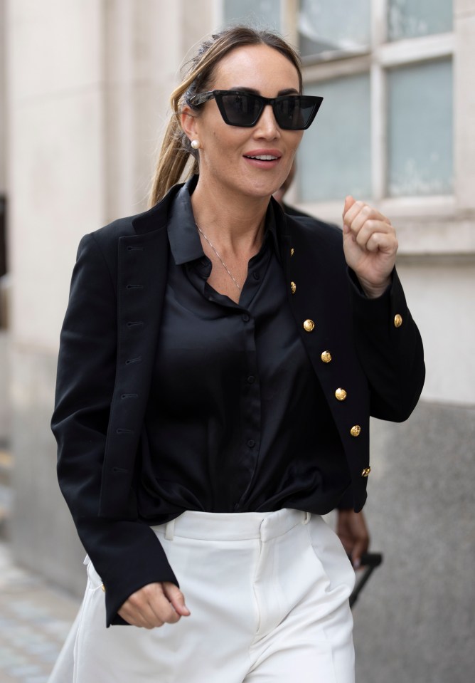 a woman wearing sunglasses and a black jacket