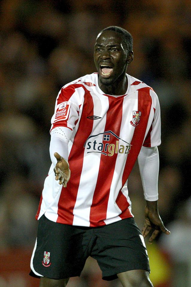 a soccer player wearing a red and white striped shirt that says starglaz