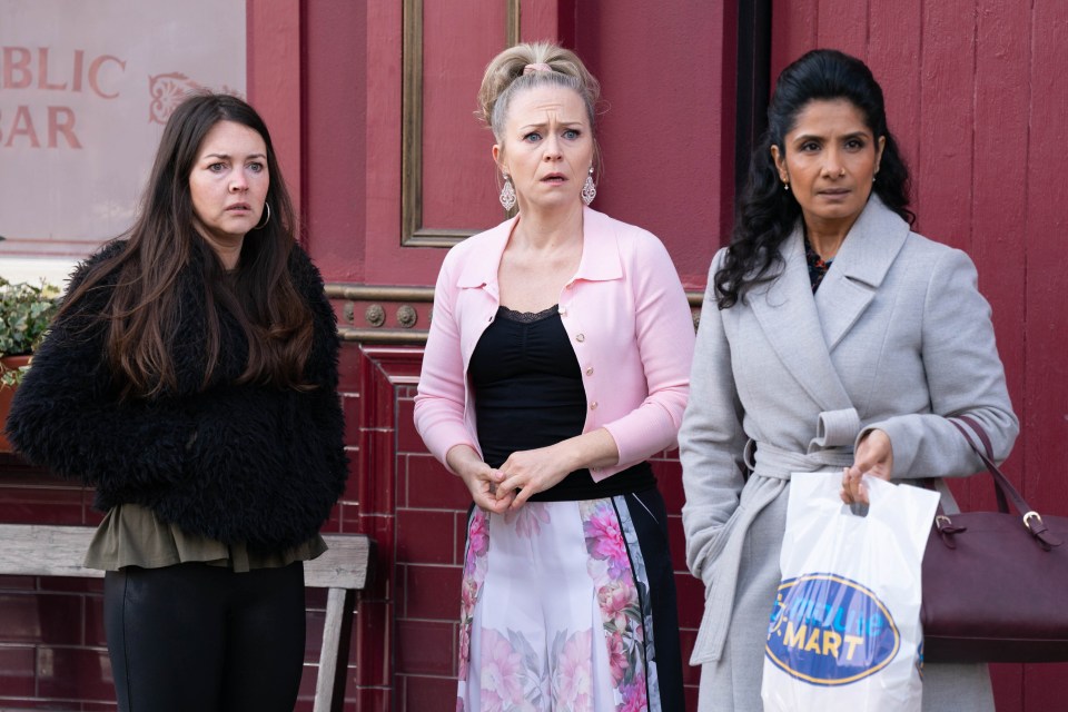 three women are standing in front of a public bar