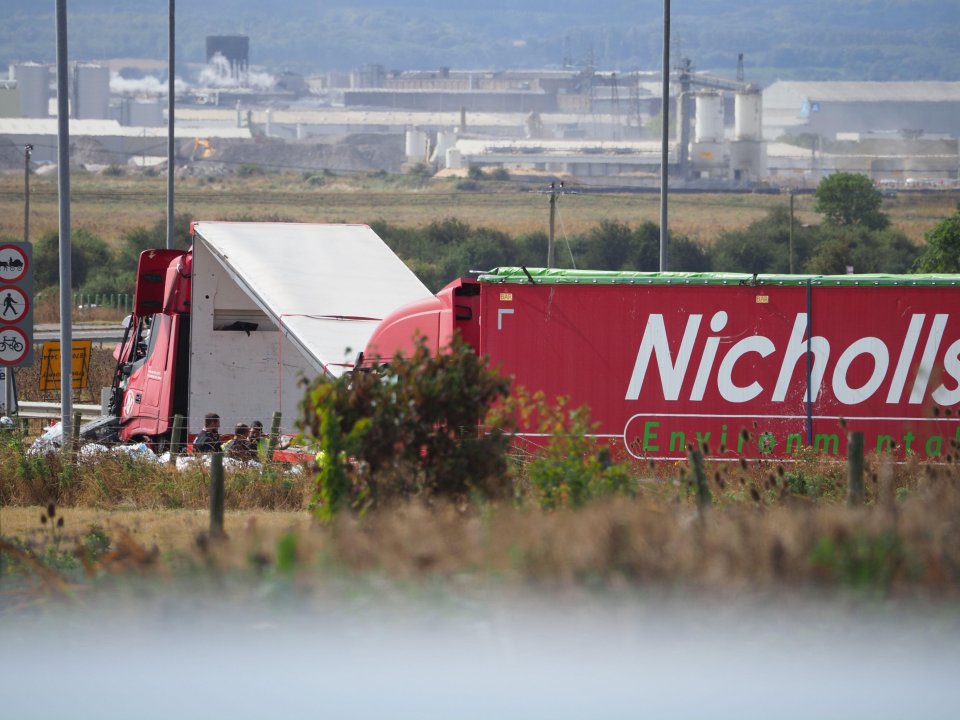 a red truck with the word nicholls on it