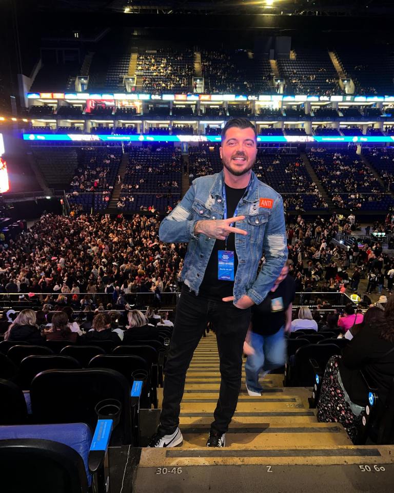 a man in a stadium with a name tag that says ana