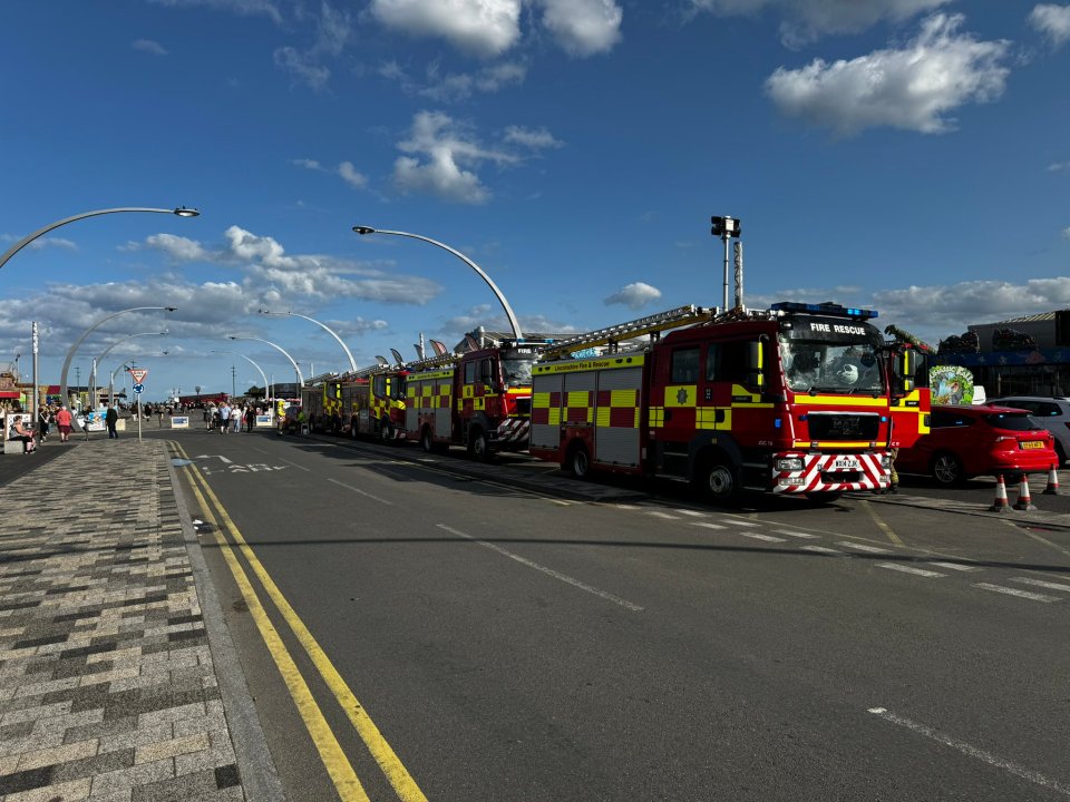 a fire rescue truck is parked on the side of the road