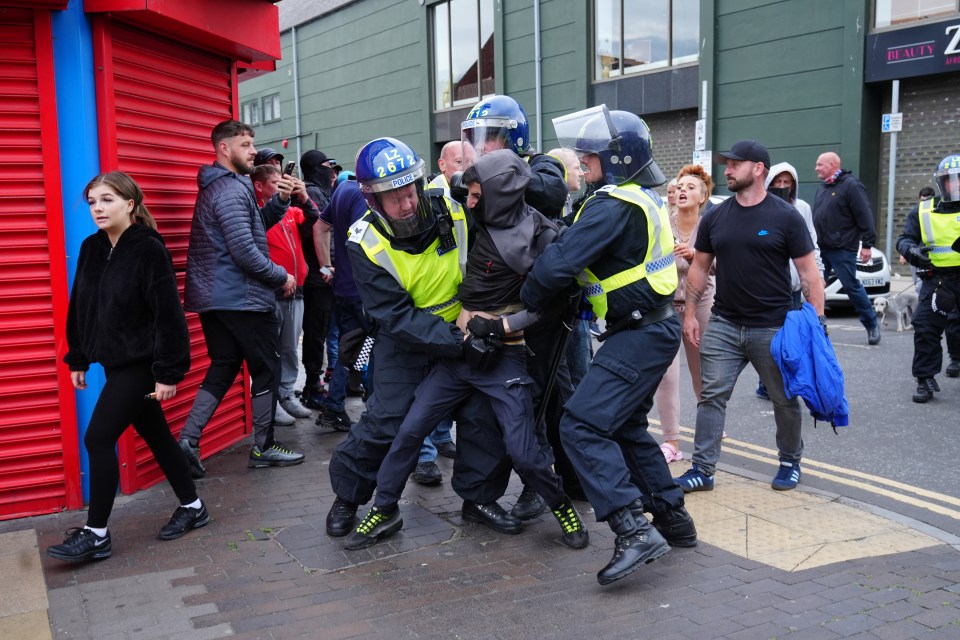 A man detained by police officers in Middlesbrough