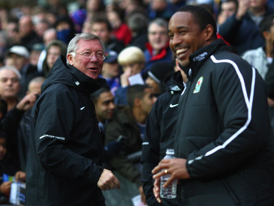 a man wearing a jacket that says manchester united on it