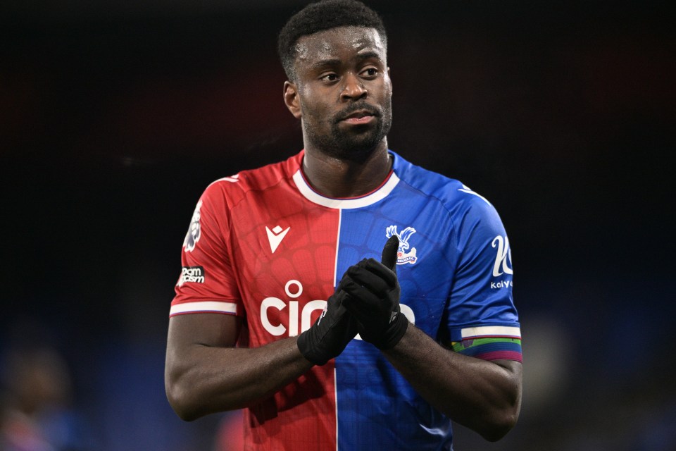 a man wearing a red and blue jersey with the word cic on it