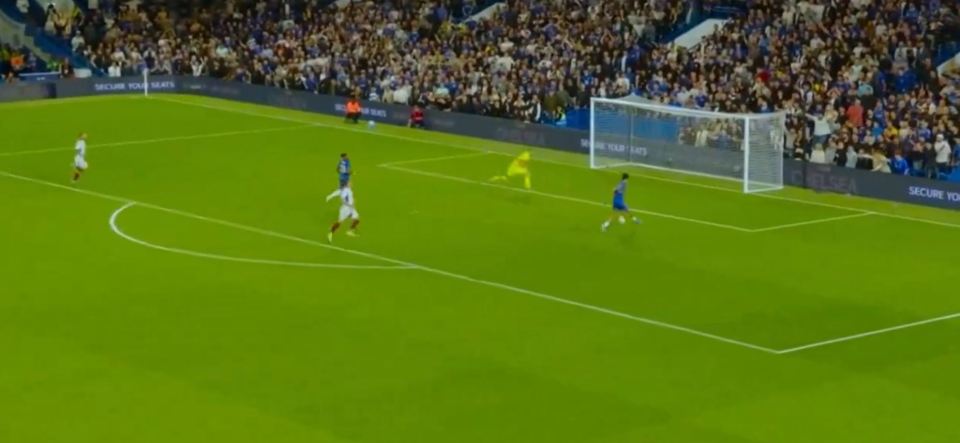 a soccer game is being played in front of a secure your seats banner