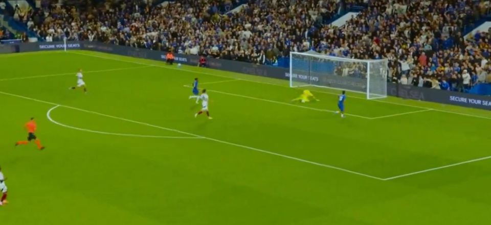 a soccer game is being played in front of a crowd with a banner that says secure your seats