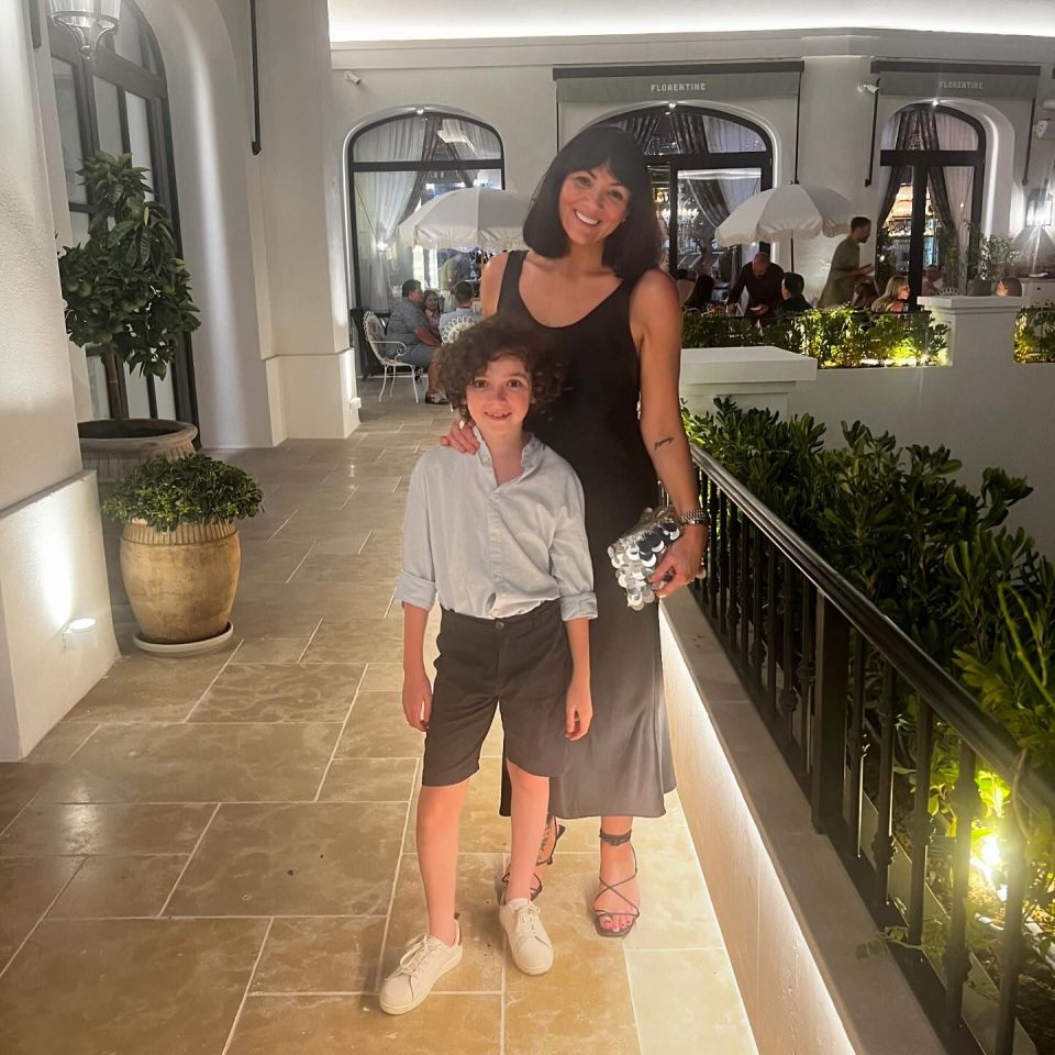 a woman and a boy are standing in front of a restaurant called florentine