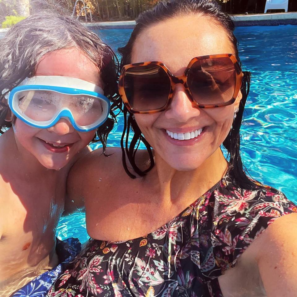 The star is currently enjoying the sun on holiday with her nine-year-old son