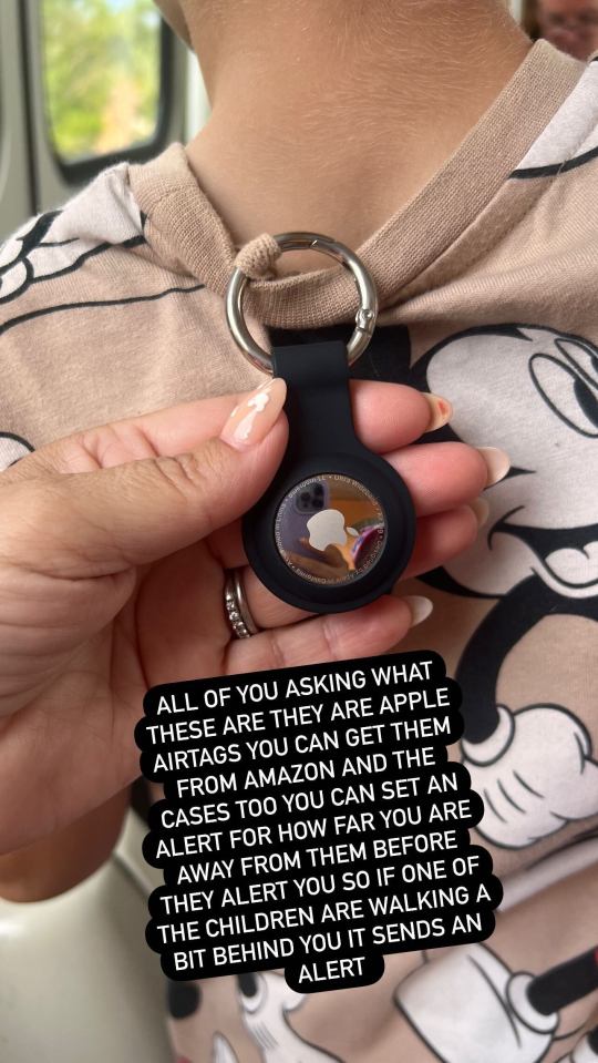 a person holding a keychain that says " all of you asking what these are they are "