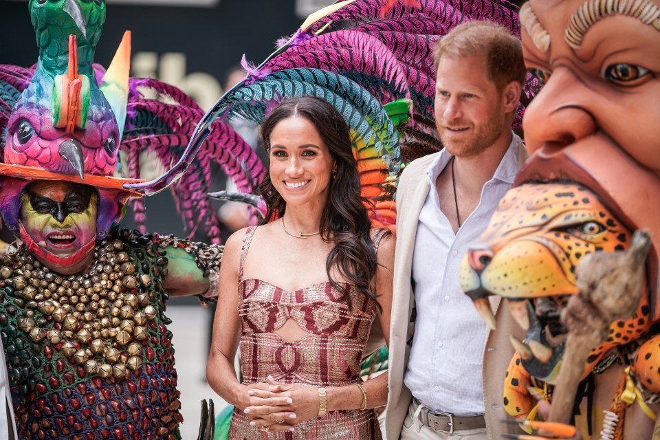 Prince Harry and Meghan Markle pose for a photo at Centro Nacional de las Artes Delia Zapata during a visit to Colombia