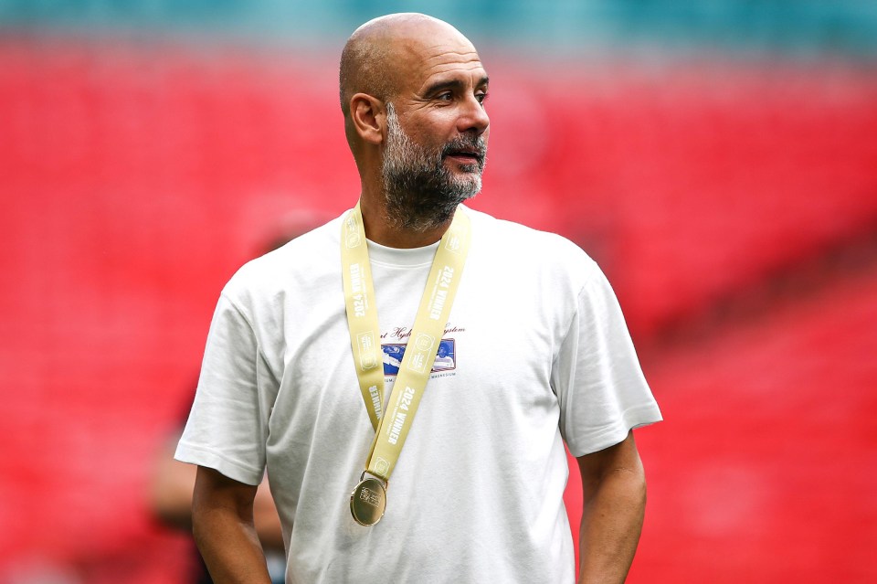 a man with a medal around his neck that says 2014 world cup