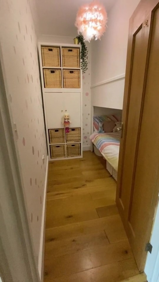 A mum has divided opinion after showing how her husband divided their daughters' room into two