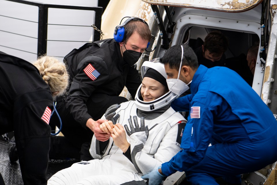 Nasa astronaut Kayla Barron is helped out of the SpaceX Crew Dragon Endurance spacecraft after a splashdown in the Gulf of Mexico in May 2022