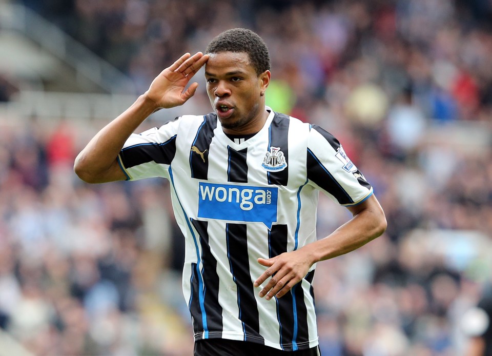 soccer player wearing a black and white striped shirt with a wonga logo on the front