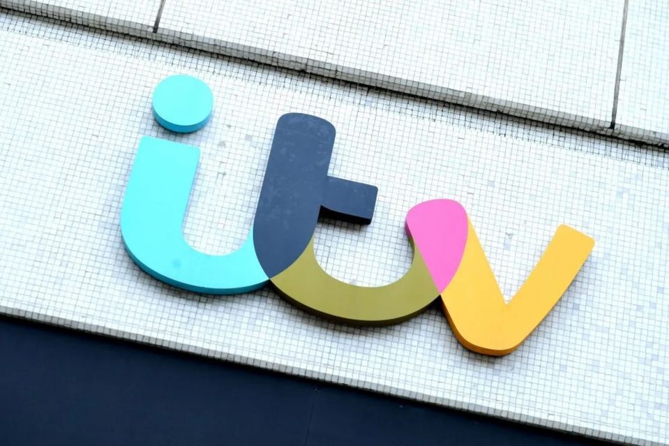 a colorful sign that says ' itv ' on it