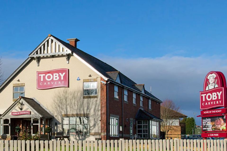 a toby carvery sign is outside of a building