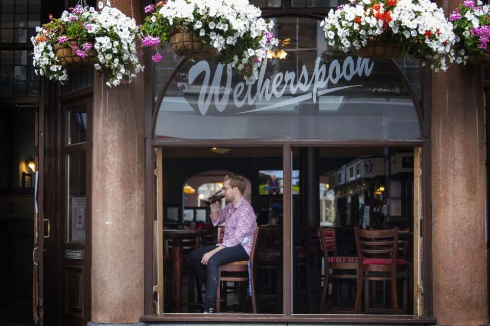 a man sits in the window of the werthersspoon