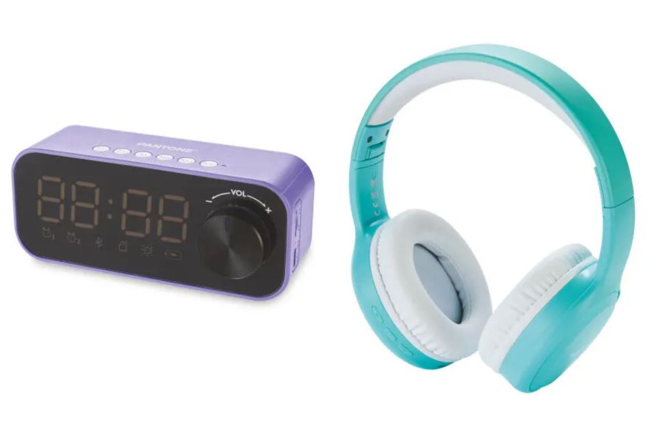 a purple alarm clock next to a pair of blue headphones