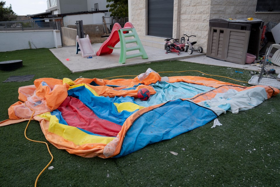 Shrapnel burst an inflatable slide where the Nidam family's kids were playing shortly before the blitz