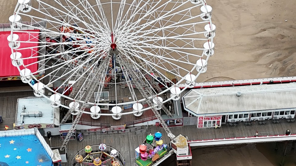 The hatch is between the Wheelhouse Cafe and the Ferris wheel