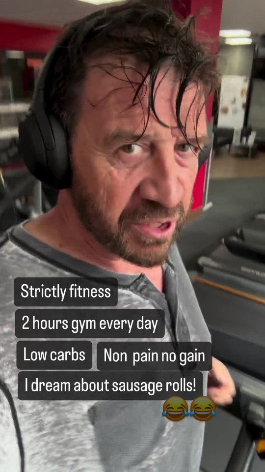 a man wearing headphones says strictly fitness 2 hours gym every day low carbs non pain no gain i dream about sausage rolls