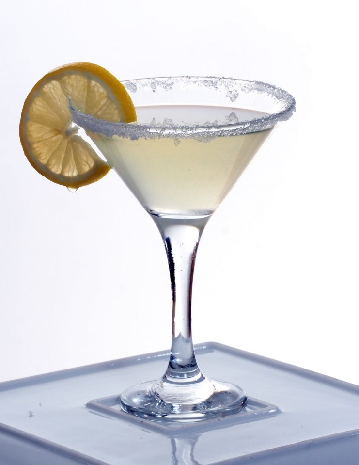 a martini with a slice of lemon on the rim