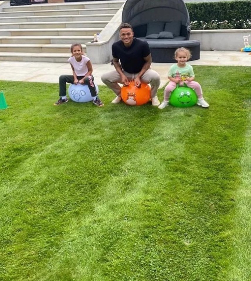 Jenas playing with his children in the garden