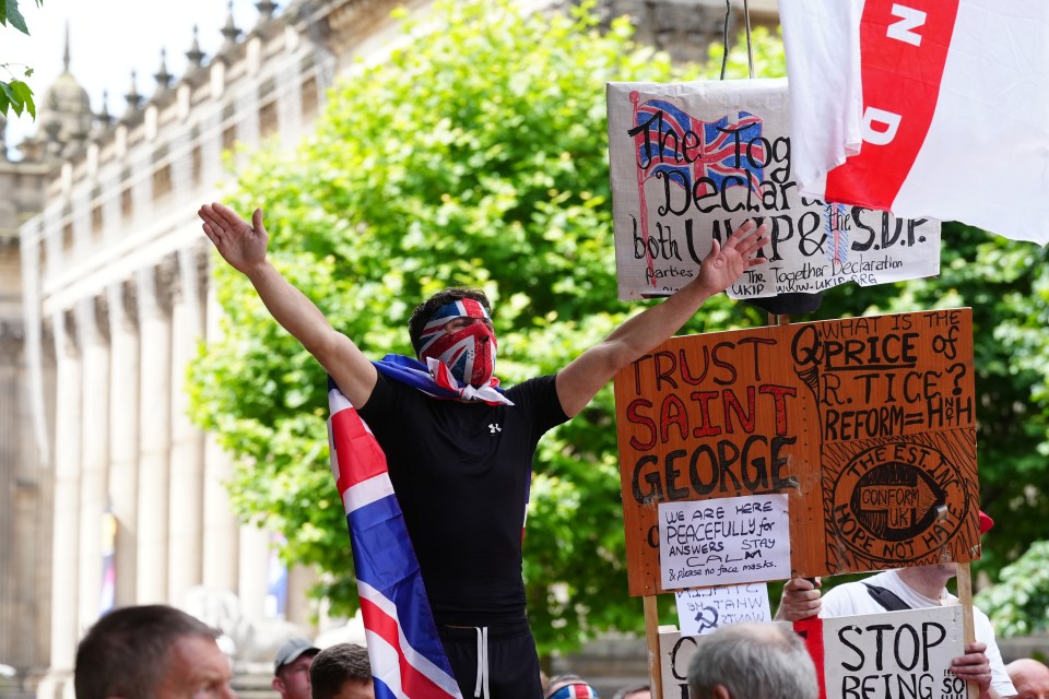 People protest outside Leeds Town Hall following the stabbing attacks on Monday