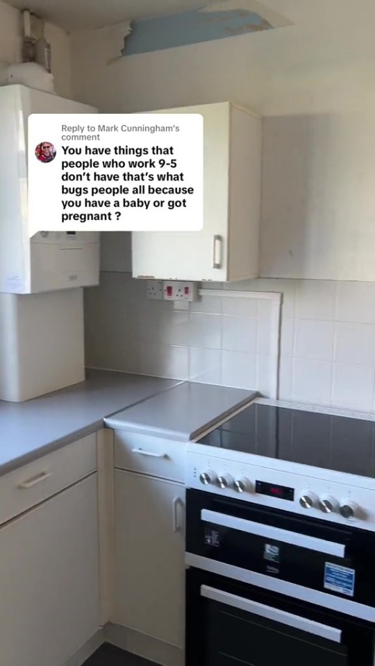 a kitchen with white cabinets and a stove top oven