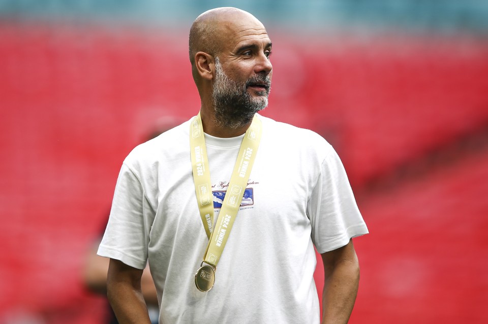 a man with a medal around his neck that says 2014 world cup