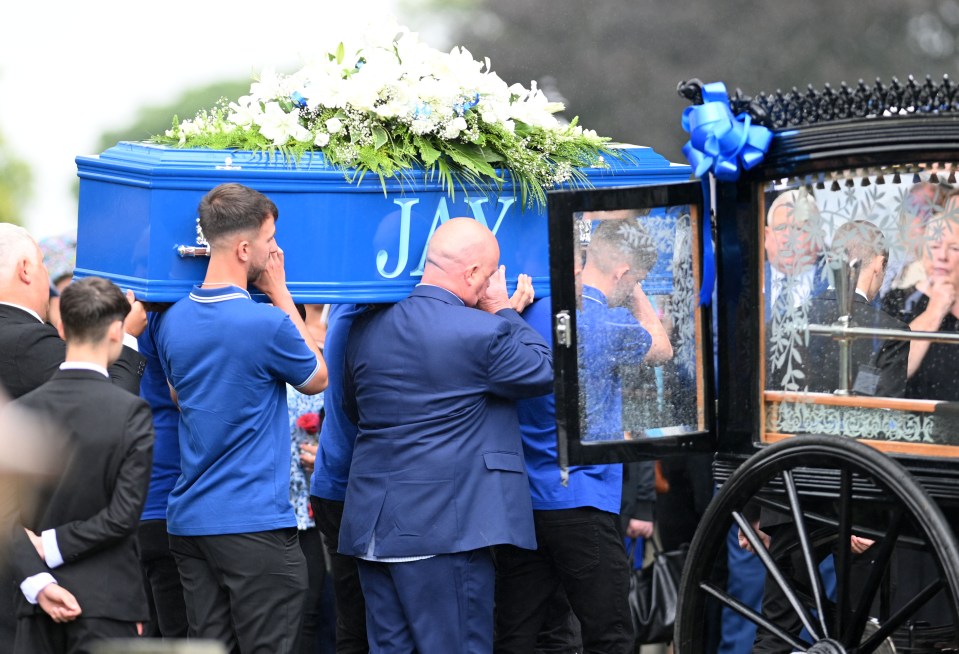 a blue coffin with the word jay on it