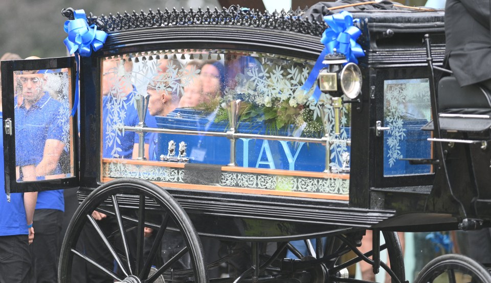 a horse drawn carriage with the name hay on it