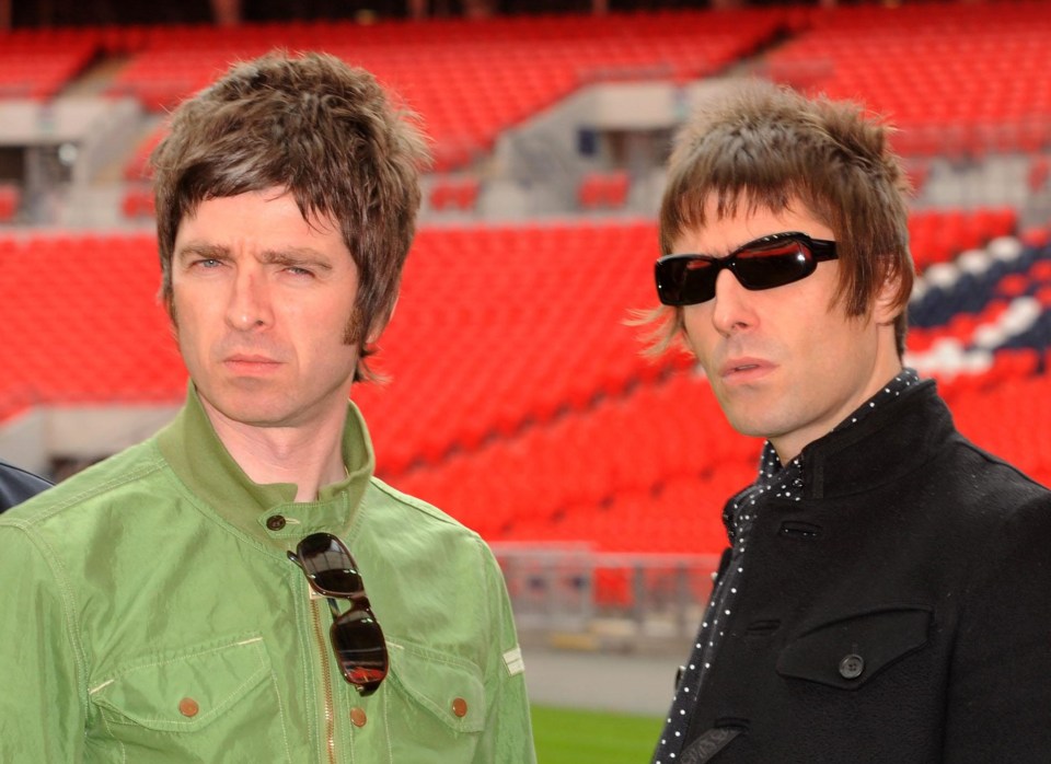 two men standing next to each other with one wearing sunglasses