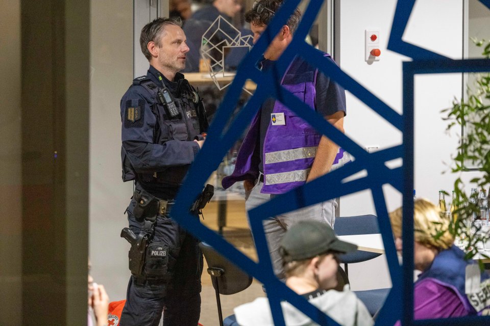 A police officer stands next to pastors in the city centre